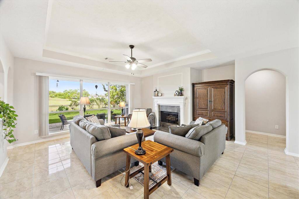 Gas log fireplace, tray ceiling and a beautiful view!