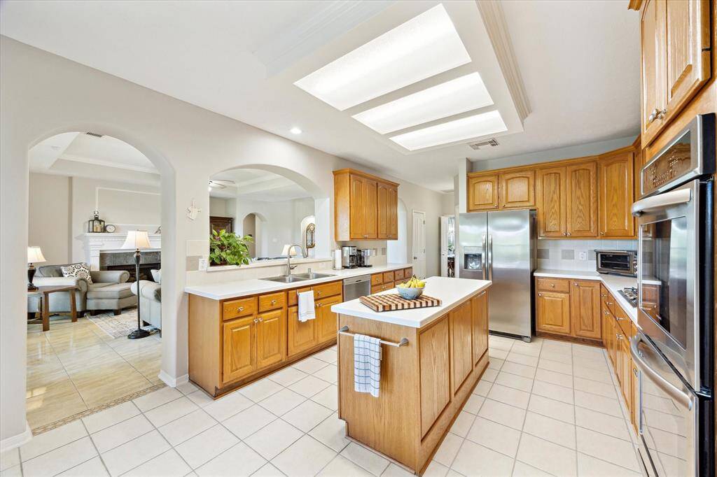 Kitchen opens to the living area. The door in the distance is th walk-in pantry.