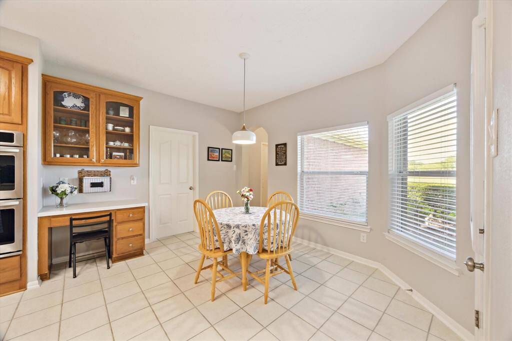 Watch the ducks fly in while you have your coffee in the breakfast room. The door by the desk leads to the laundry room. Down the hall is a bedroom and full bath.