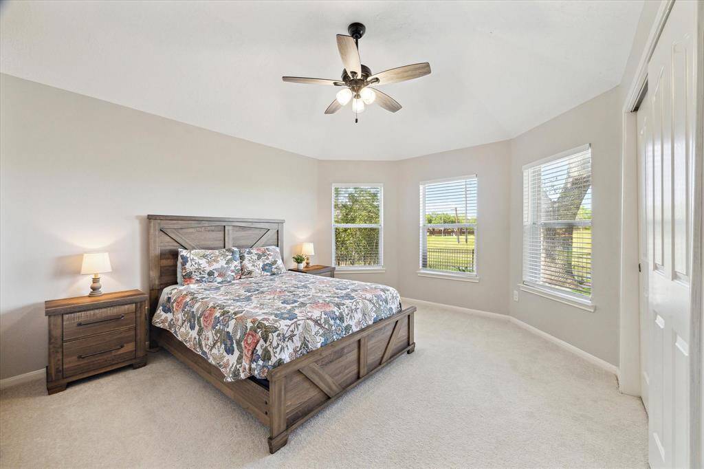 This secondary downstairs bedroom has great closet space and an adjacent full bath. Bay window views of the back yard.