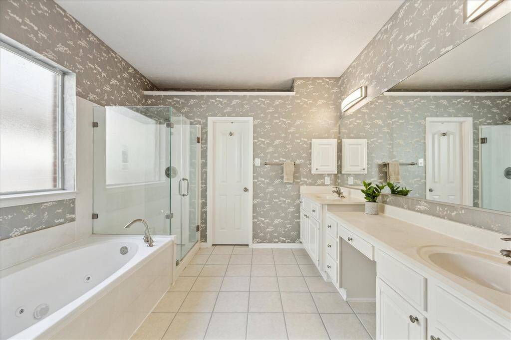 Another view of the primary bath looking towards the walk-in closet.