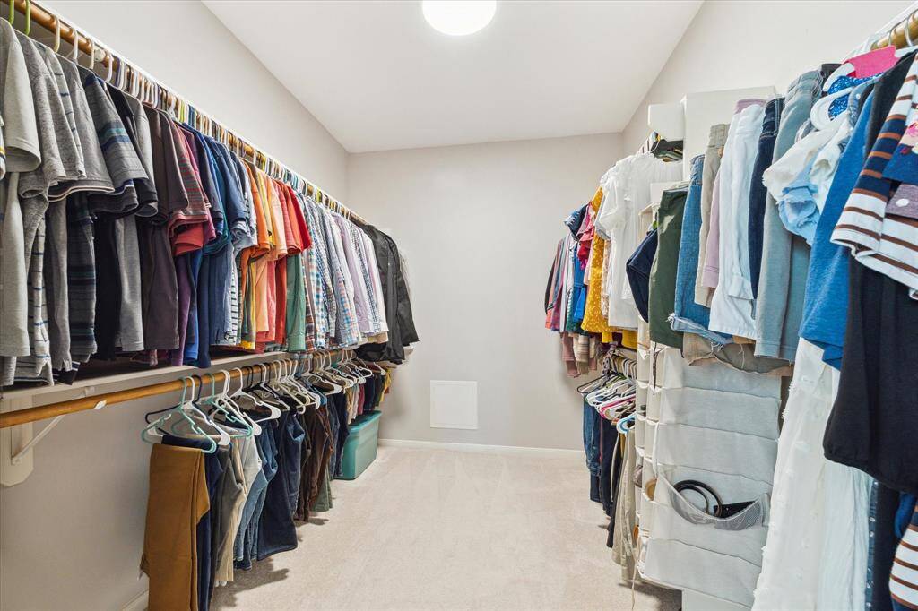 Generous primary walk-in closet.