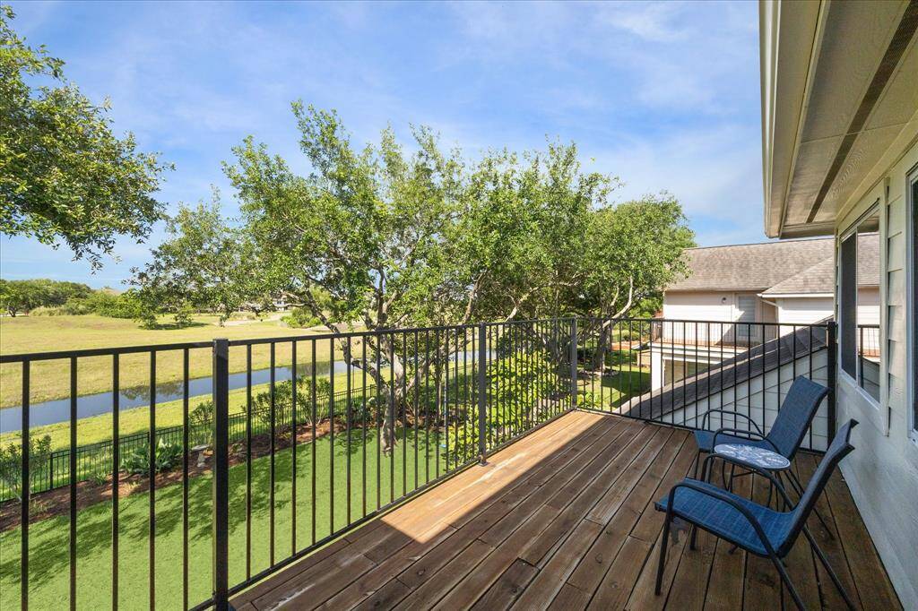 Just off the game room is a deck where you can take in the green belt views.