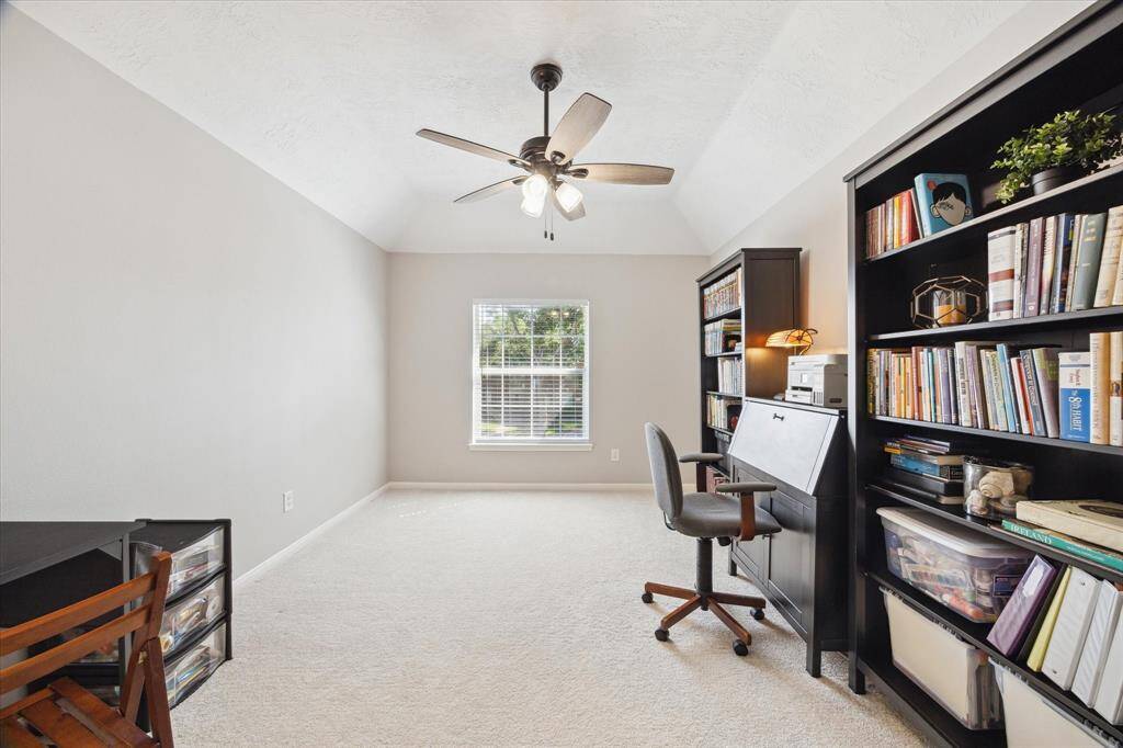 One bedroom, which has a walk-in closet, is currently used as an office.