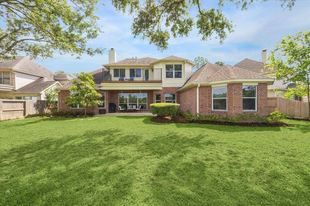 The fenced back yard has room to play, garden and entertain. Beautiful mature trees, a covered patio off the kitchen and a deck off the gameroom upstairs.