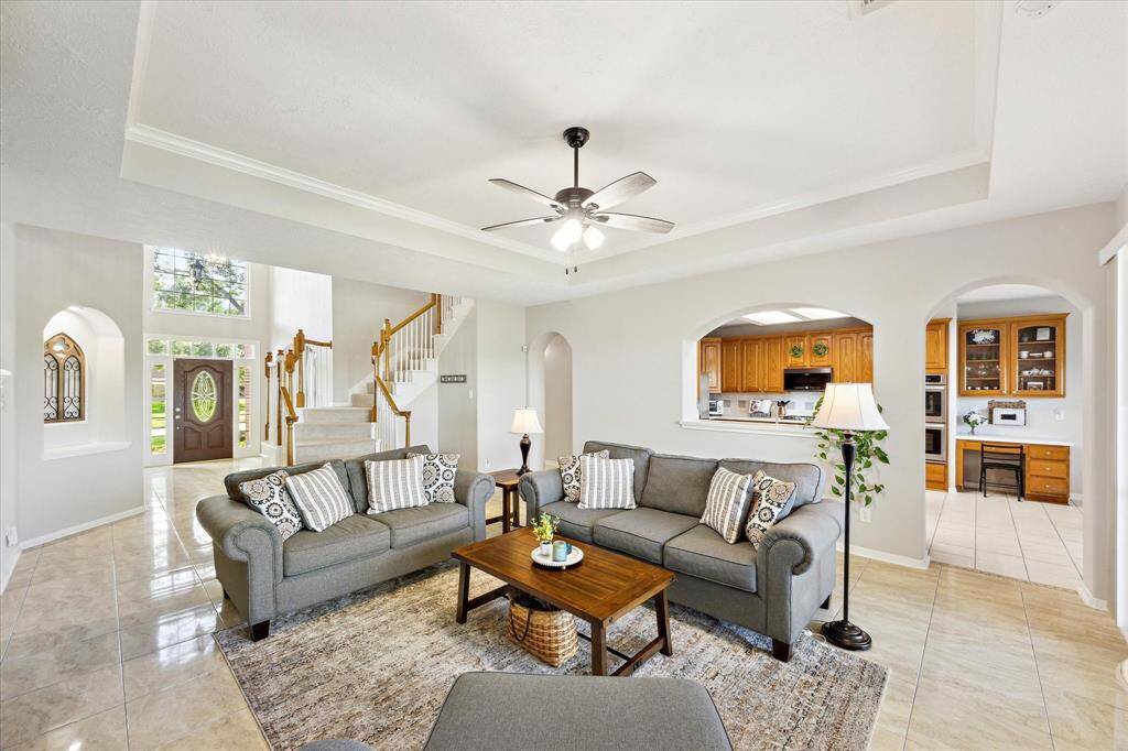 Walk further and you enter the large living room with views of the back yard.