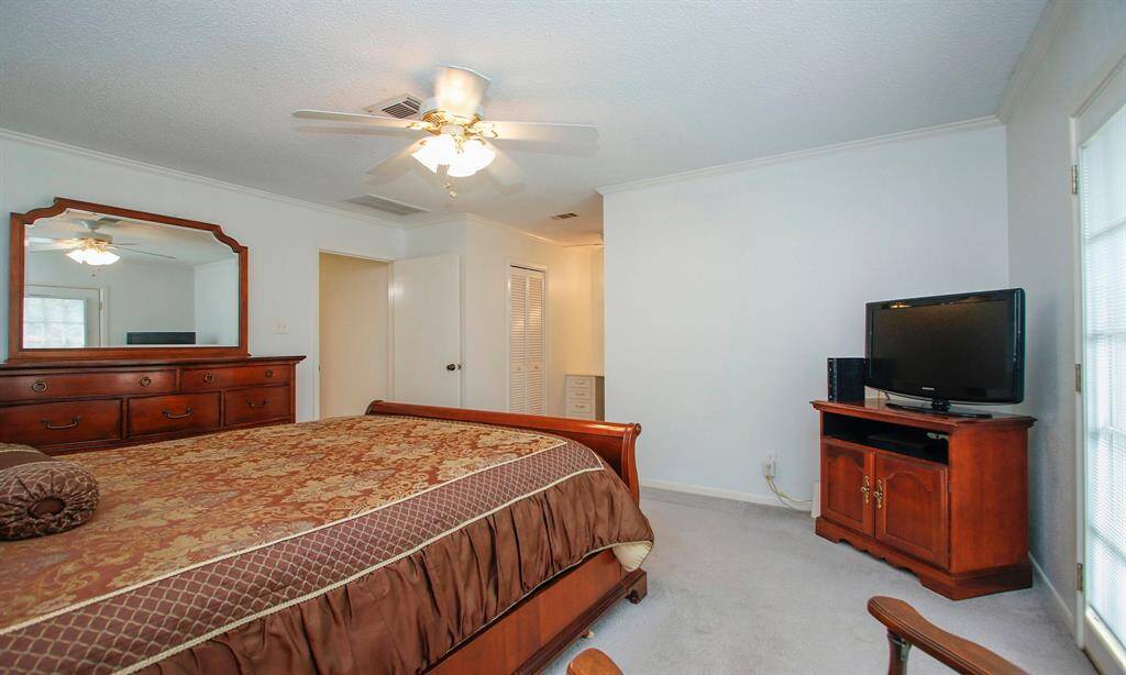 Another view of primary bedroom