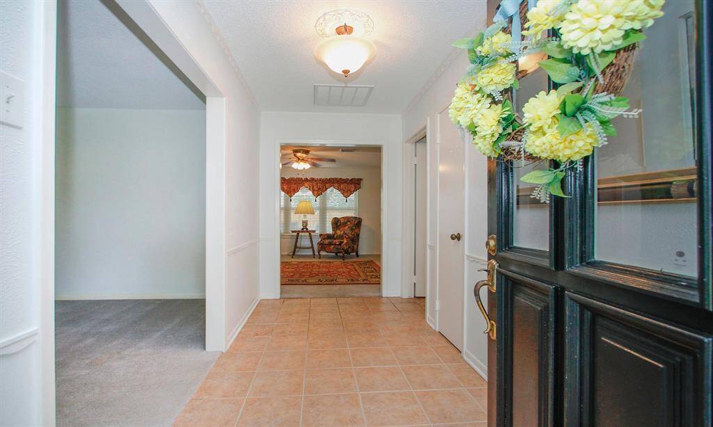Front door opens to entry way with formal living and dining room to your left.