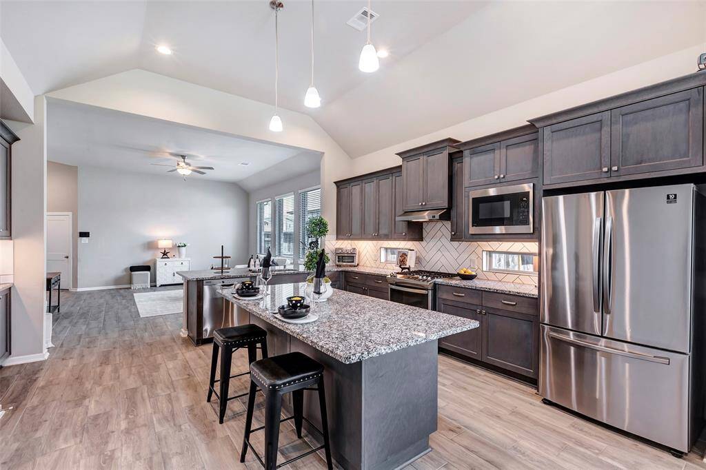 This view of the kitchen provides a clear look at its thoughtful layout, designed for both style and functionality, perfect for cooking and entertaining.