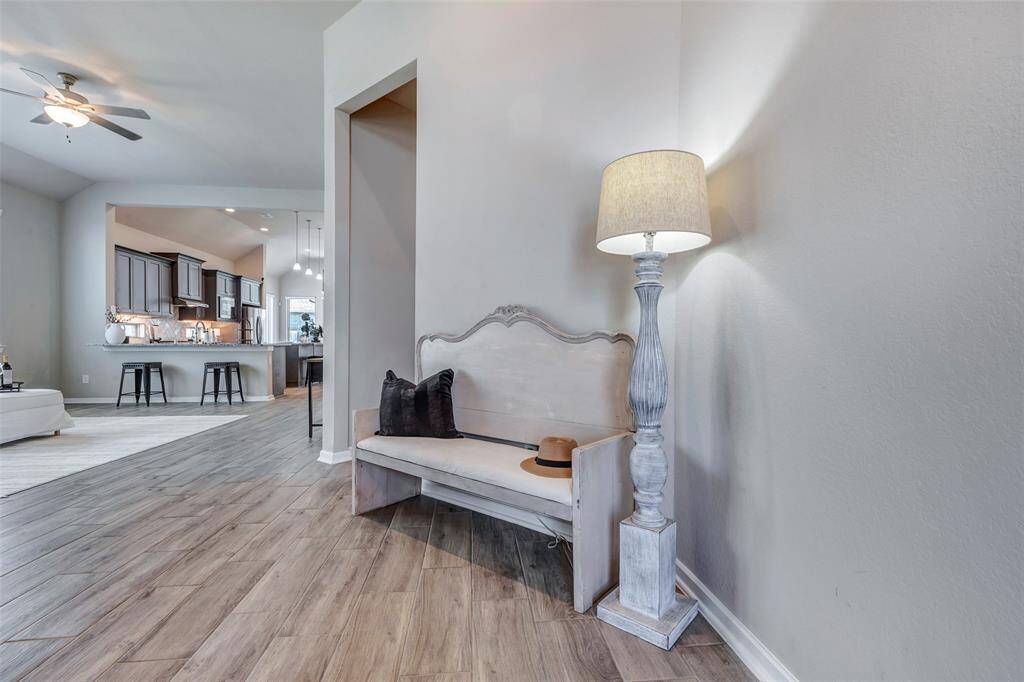 Stepping out of the foyer, you're greeted by a spacious open-concept layout that seamlessly connects the living room, kitchen, and dining area—perfect for both everyday living and entertaining.