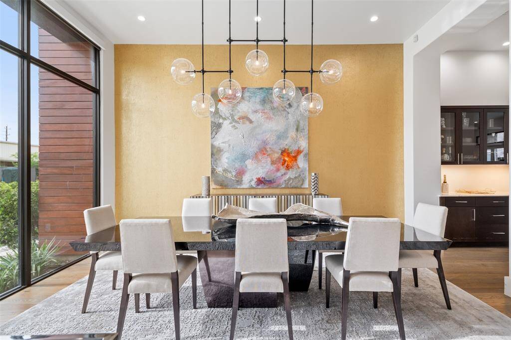A striking accent wall and modern chandelier.