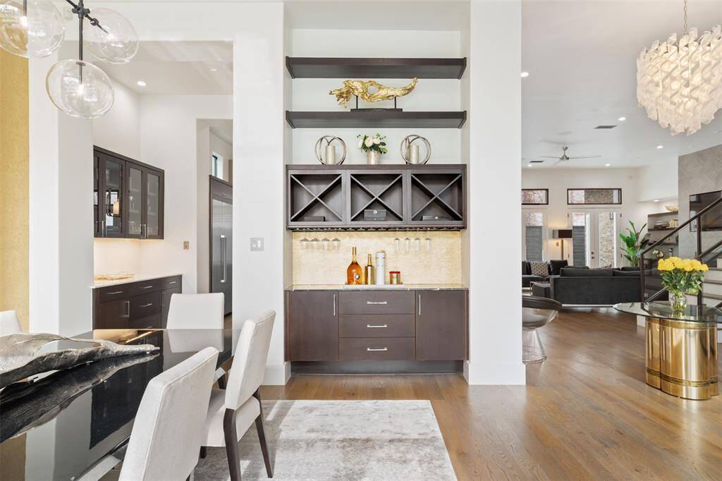 A butler's pantry and wet bar sit gracefully next to the dining room.