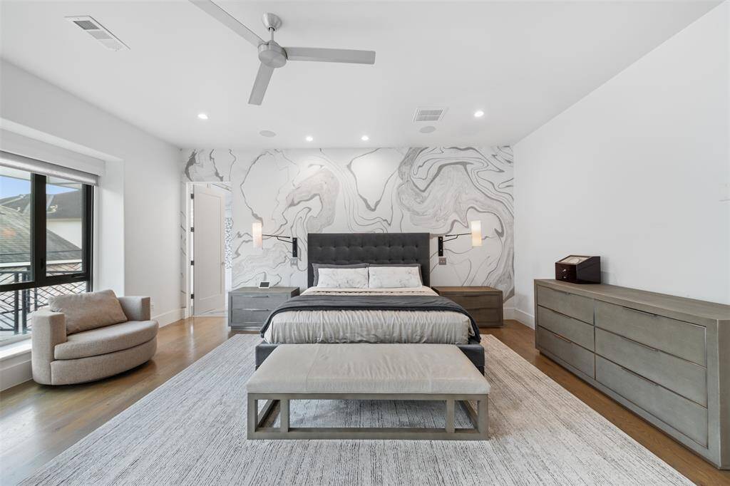 The primary bedroom also has a balcony overlooking the back yard and access to the roof.