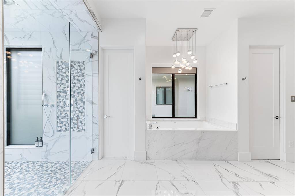The primary bath has an amazing walk-in shower and double wc's so everyone can have their own private space.