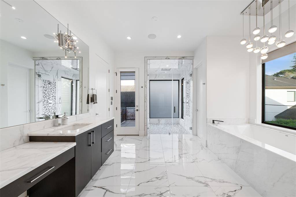 Relax in this serene primary bath and large jetted tub.