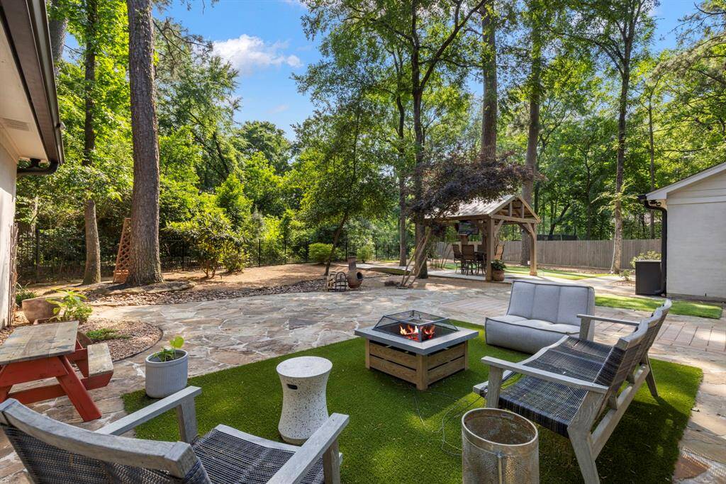 The backyard is a private oasis, beautifully landscaped and completely serene, offering the perfect escape from the hustle and bustle of everyday life.