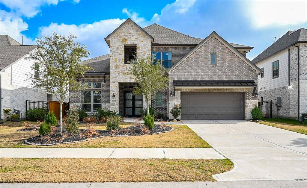 It's probably no coincidence that the word "regal" appears in the address of this exquisite 2 -story, brick/stone beauty at 27127 Regal Scott Drive, Magnolia, TX, in the lovely Northgrove community.