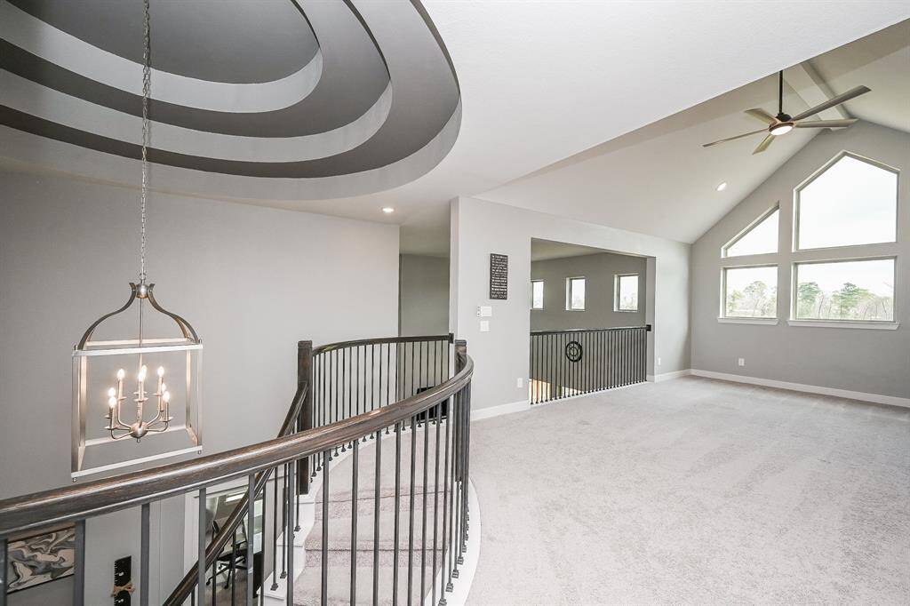 What a marvelous, breathtaking view here at the top of the 2nd floor staircase landing; with fabulous domed ceiling, high ceiling, windows everywhere and lots of carpeted space for true gaming gear and/or secondary living room pieces.