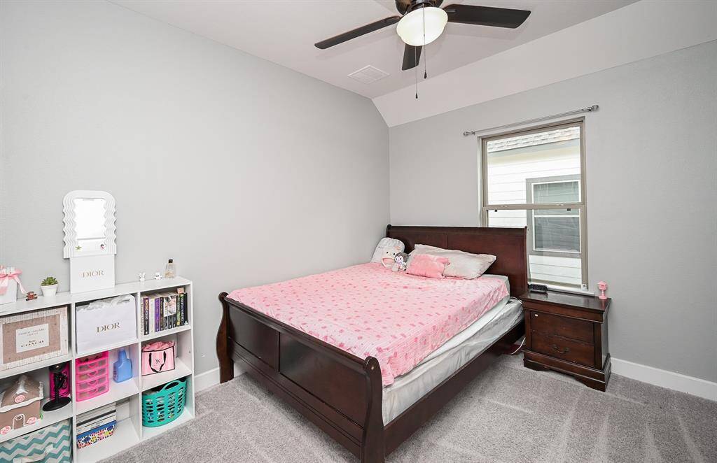 Another secondary bedroom easily welcomes sizeable pieces.