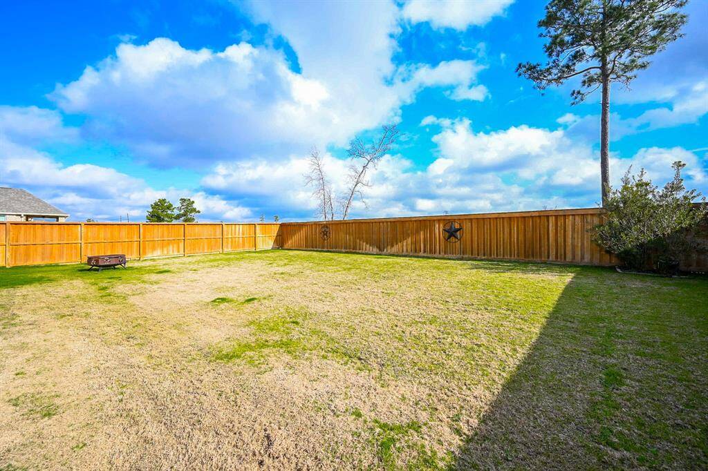The entire back property is fenced in for added security and privacy.