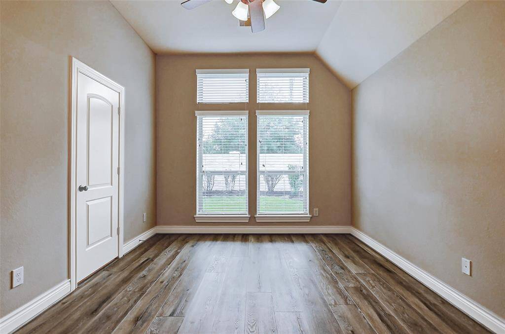 Beautiful wood floors, high ceilings and lots of natural light make this room perfect for guests or family.