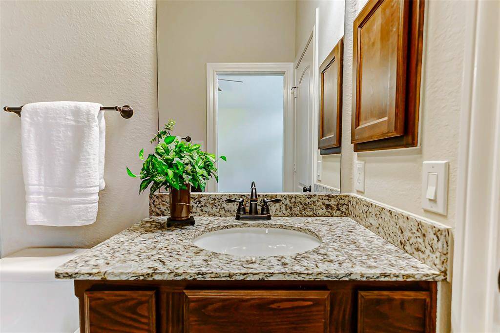 This bathroom is located between the room with the navy wall and the one with the mint green walls.