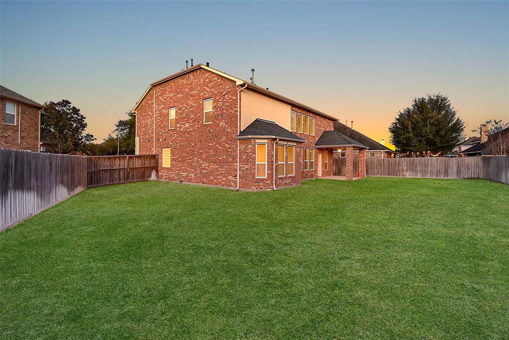 Well-maintained backyard with plenty of space for outdoor activities and entertaining.