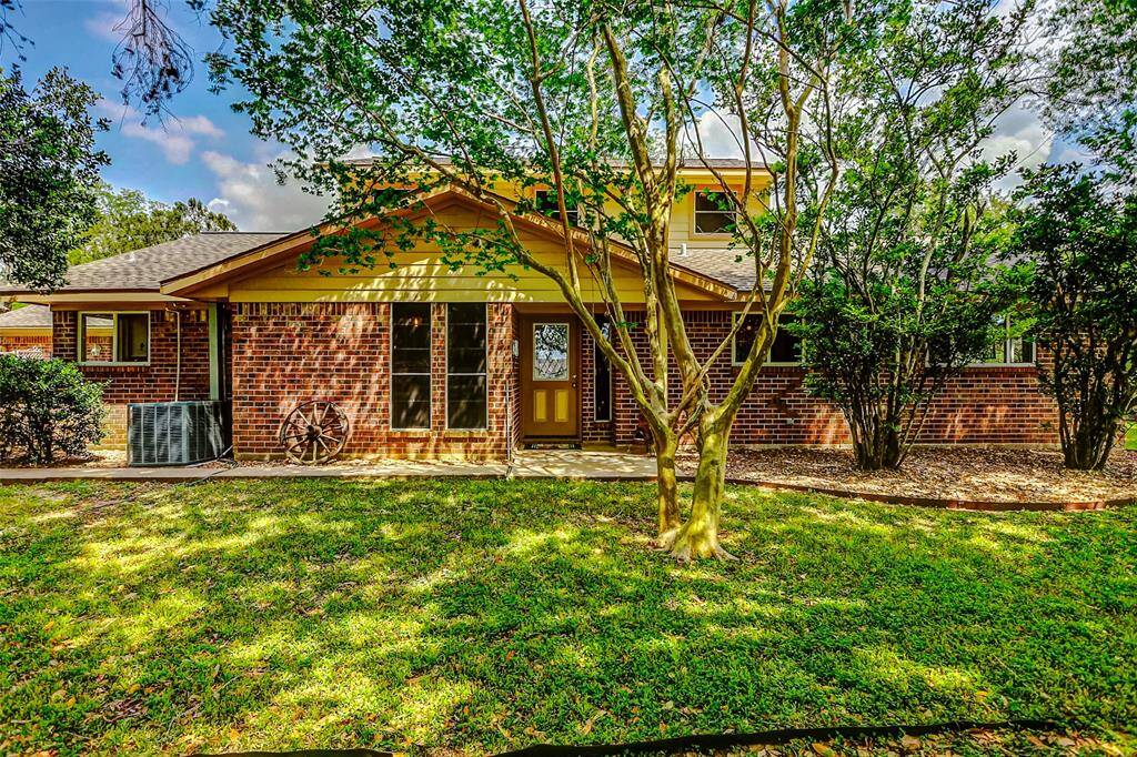 Entrance of the brick and cement siding home with upgraded exterior windows, 5 year roof and high speed fiber optic internet for personal or business use.