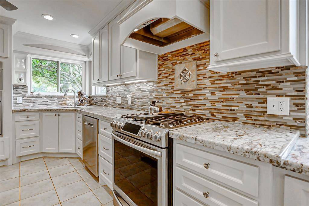 This home has a free standing gas stove and oven and a separate electric oven and convection microwave.