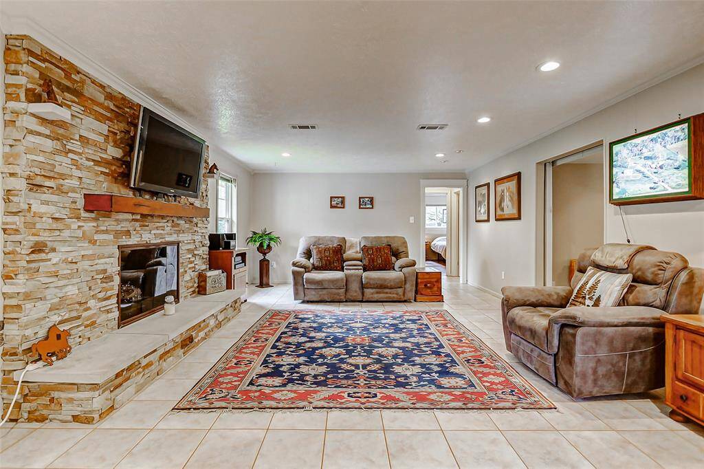 This large living area with custom stone wood burning or gas fireplace is great space for large gatherings or a quiet evening at home.