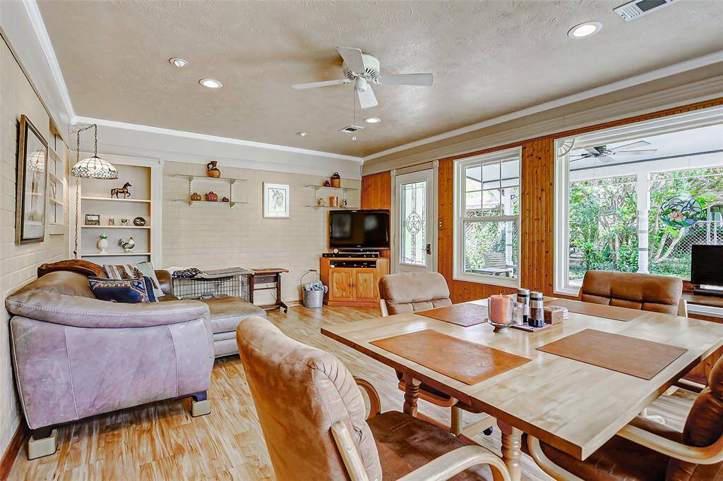 A second multi functional area off of the living room can be used as a cozy sun room, extra dining space, or an office.