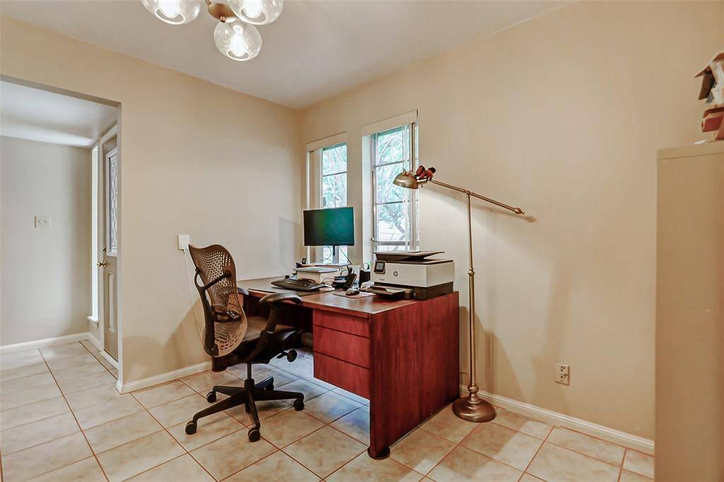 This space is located just off of the kitchen and can be used as a formal dining area or office space.