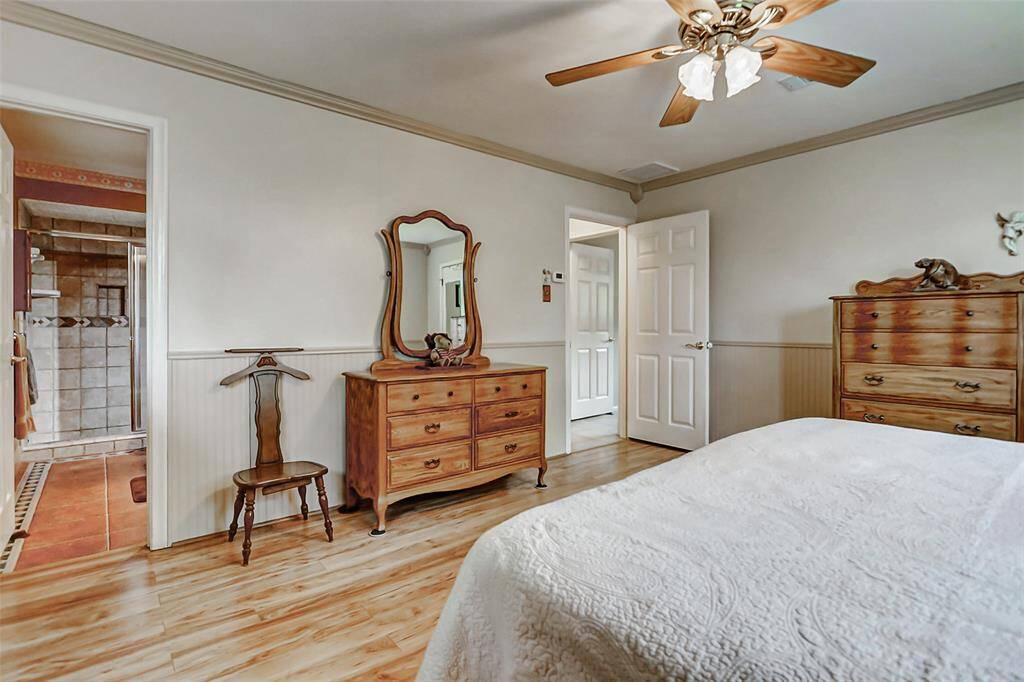 The primary bedroom with a view in to the primary bath.