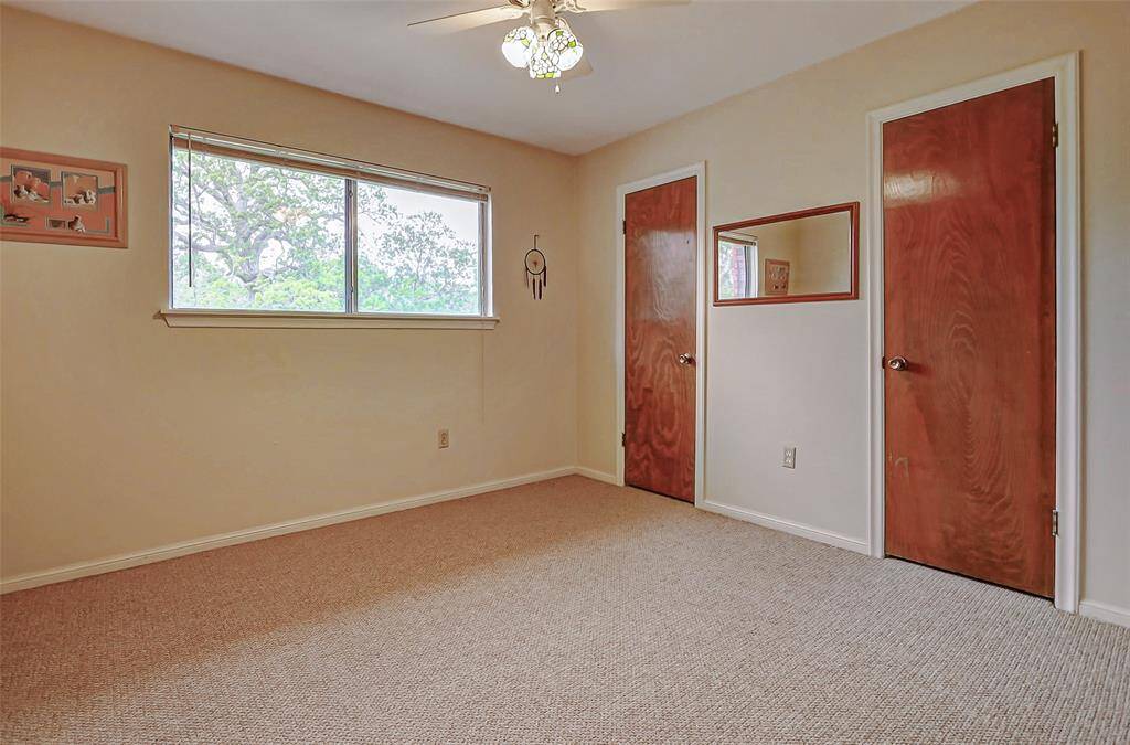 One of two bedrooms upstairs with double closets and views of the backyard.