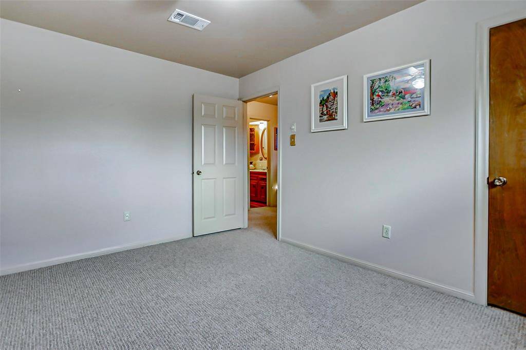 Another upstairs bedrooms has a walk in closet.