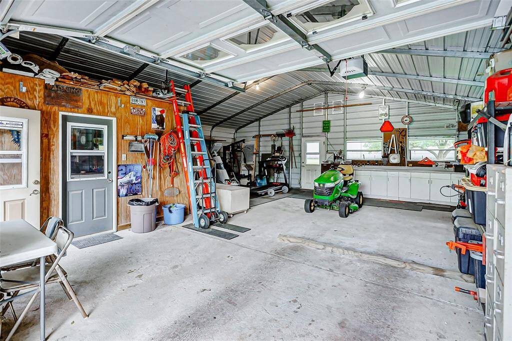 The interior of the building has a storage room with built in cabinets.  The workspace is large enough for hobbies. projects and a workout area.