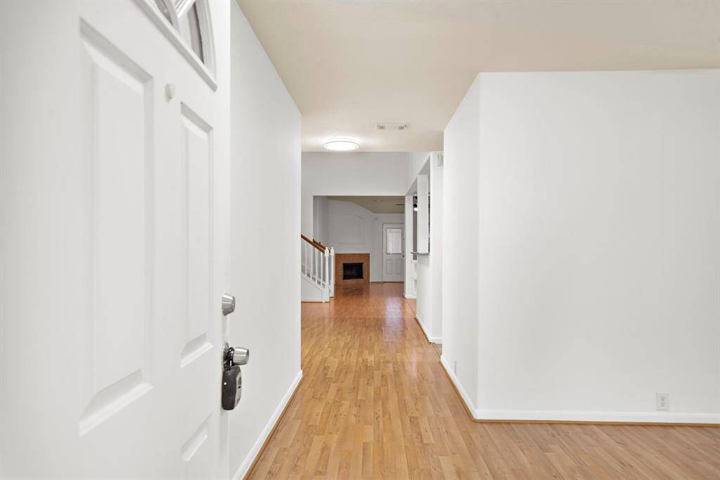 Spacious walk way from the entrance leading to the living area.