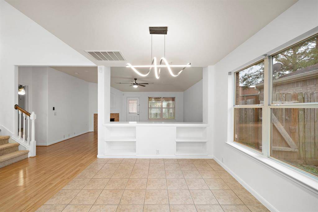 Beautiful updated light fixture above dining area.