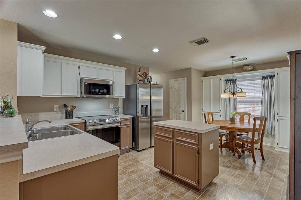 This kitchen offers space to work, storage and serving areas.