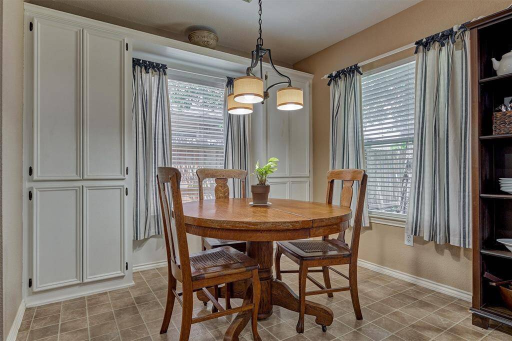 Charming breakfast room space has windows on two walls.