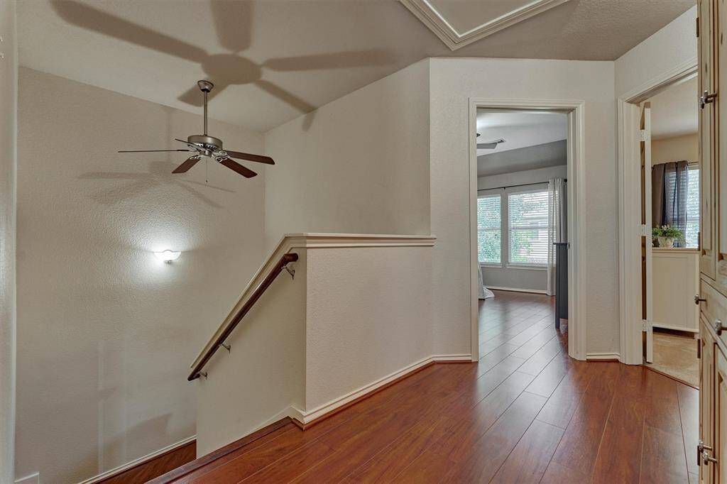 Upstairs leads to three spacious bedrooms and two baths plus 7 x 16 floored attic storage accessed by a half door.