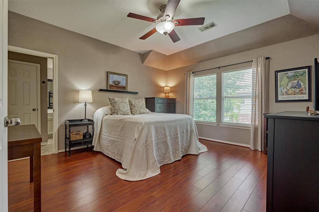 The primary bedroom is large and is joined by an ensuite bath.