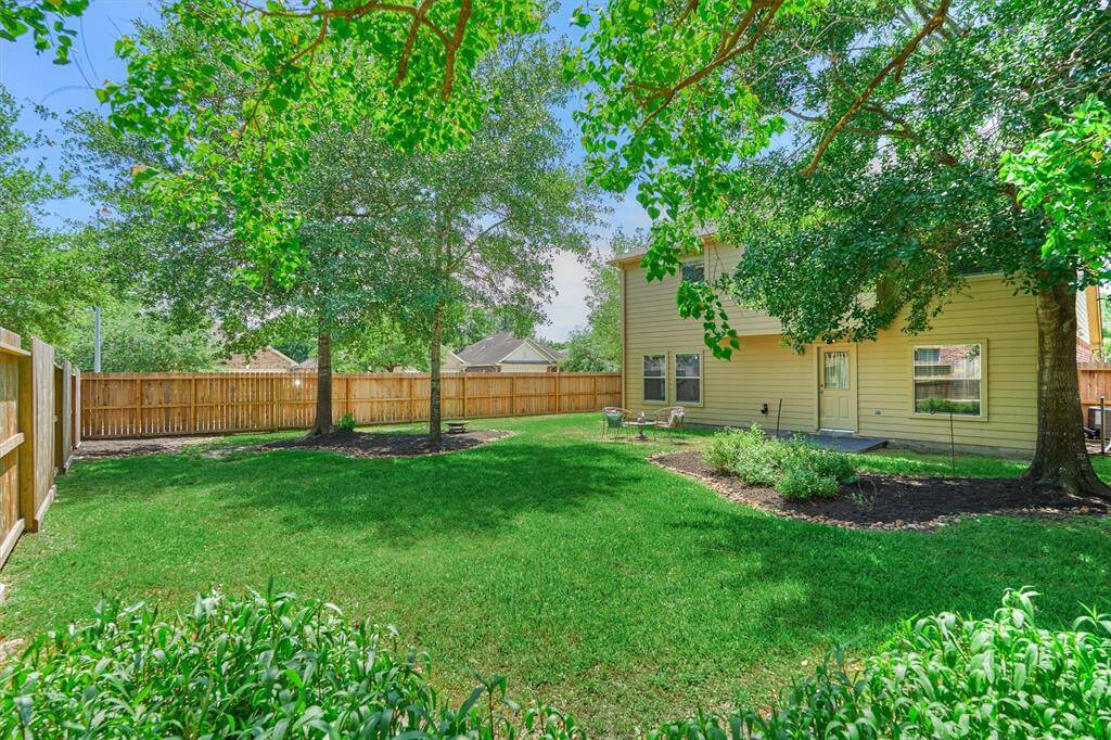 A full sprinkler system front & back keeps the yard green.