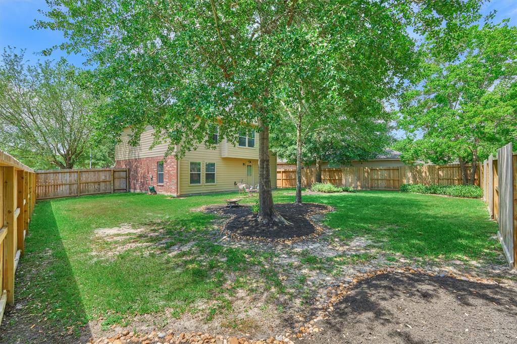 There's plenty of space for pets and children to play in this backyard.