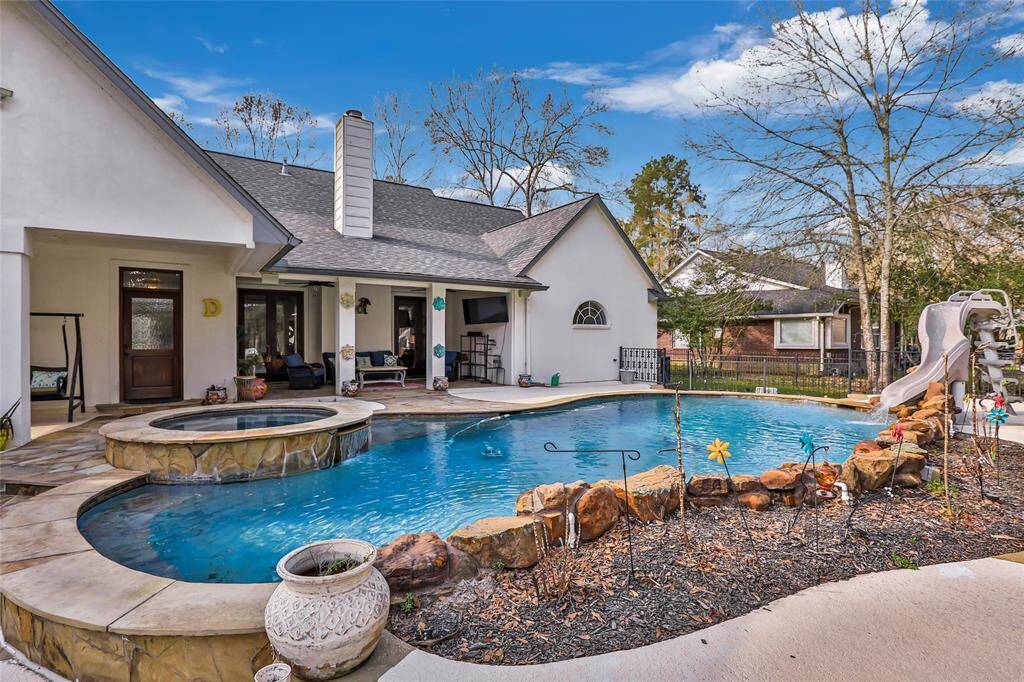 Enjoy a dip in your Outdoor Pool with Slide and Spa