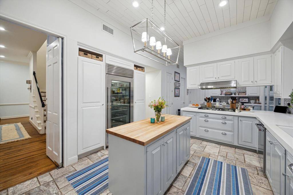 Custom Built-in Pantry flank either side of the glass front SubZero.  All appliances are serviced 1-2 times per year.  All service records, tile selections etc., to be turned over to new owner upon closing / funding.