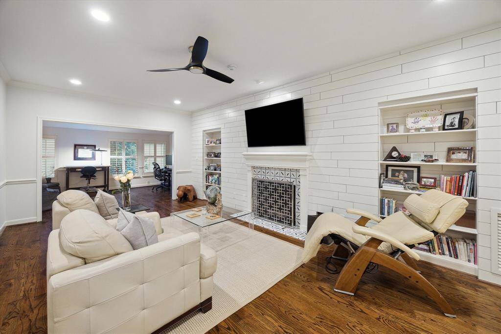 The Shiplap Barn doors can close off this Primary Parlor from the bedroom and opens to a second office for the Primary.  Shiplap adorns the walls, custom Selkie fireplace surround flanked by bookshelves and separate closet for storage.