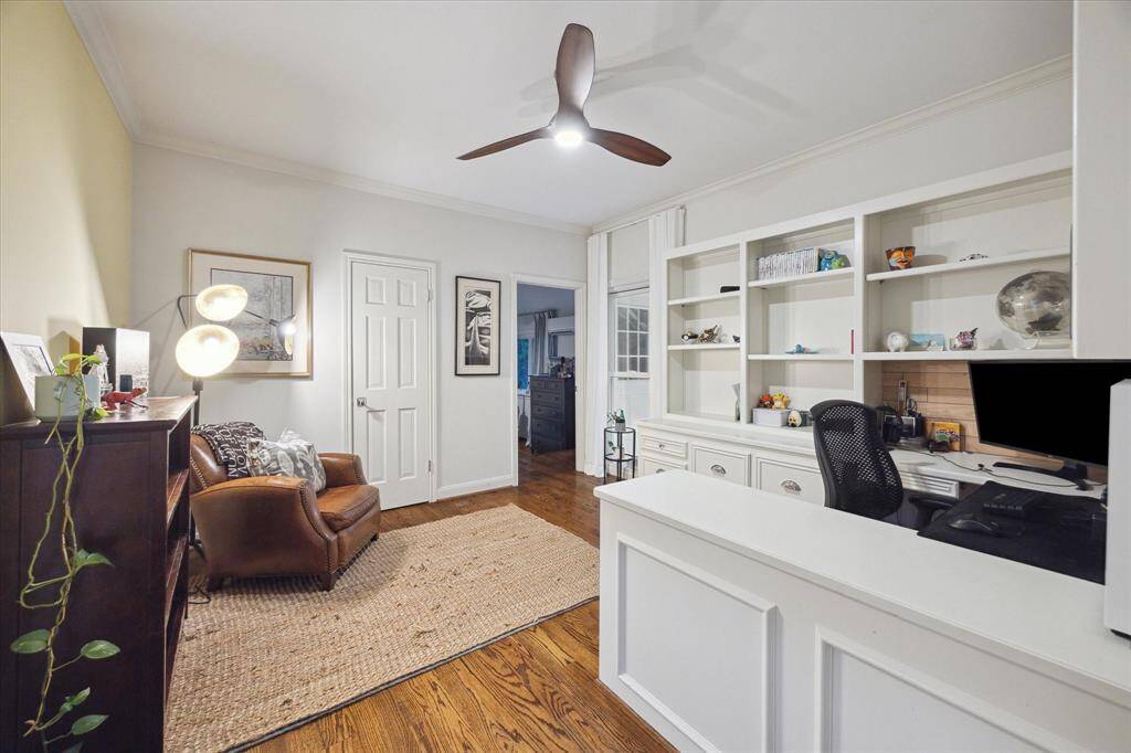 Across from the Primary you have a third office with built-ins and private bath.  This serves as a passageway to the back bedroom.