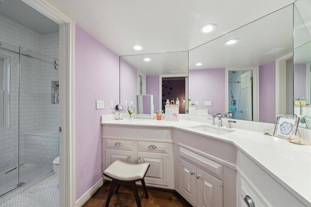 Private bath for third Bedroom.  Vanity height in all bathrooms were raised, Quartz counters put in, new mirrors and commodes and tile.