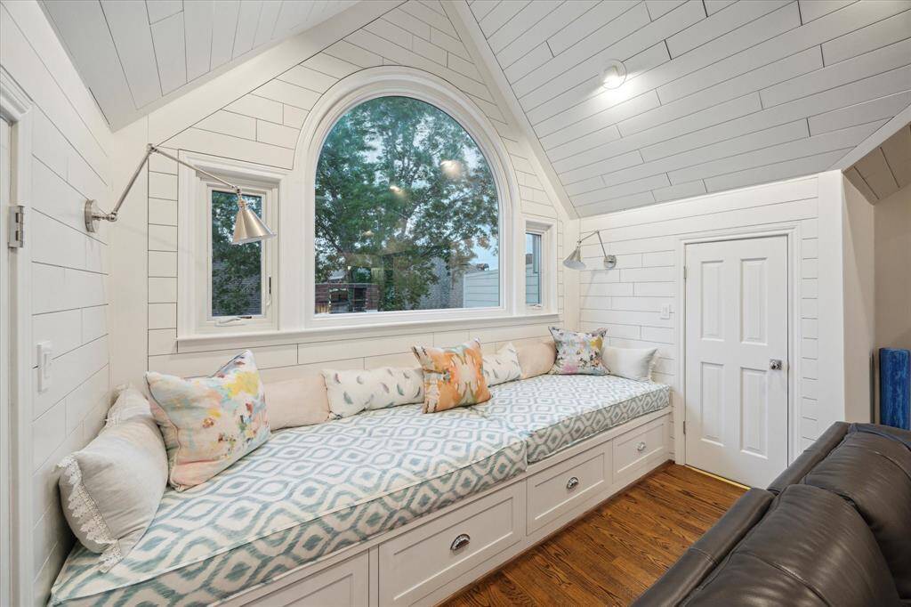 This custom built window-box seat has deep storage below and adjustable reading lights on each end.  On either side the bench you have access to the attic and water heaters.